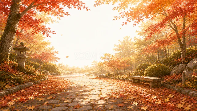 赤い紅葉とベンチがある石畳の秋の公園背景・コピースペース